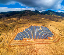 Solar farm / power plant array on plateau above Lahaina, West Maui Mountains, Maui, Hawaii. Several images combined.