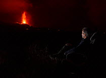 Self-portrait of photographer Eduardo Blanco, watching volcanic eruption, Cumbre Vieja Volcano, La Palma, Canary Islands. September 2021 Model released