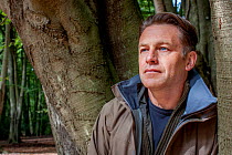 Naturalist and presenter Chris Packham during filming for BBC programme &#39;Animals Guide to Britain&#39;, Epping Forest, Essex, UK. 2010.