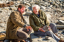 Sir David Attenborough with fossil hunter Chris Moore on location for BBC special &#39;Attenborough and the Sea Dragon&#39;, Lyme Regis, Dorset, UK, 2016. EDITORIAL USE ONLY.
