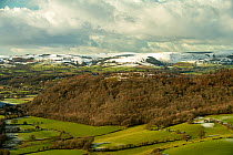 Stanner Rocks National Nature Reserve, snow-capped hills of the Radnor Forest Radnorshire Wales viewed from Bradnor Hill, Herefordshire, the Welsh Marches, UK. January, 2021.