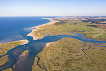 Aerial view of tidal creeks and saltmarsh with view towards Gun Hill and Holkham, Scolt Head Island, North Norfolk, UK. September, 2020.