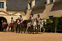 First Empire Military Re-enactment: People dressed in uniform on horseback - from right: four Second Regiment de Hussards, Marechal Murat, Prince De Salm, Colonel of the Seventh Regiment de Hussards o...