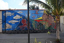 Wall painting of a marine scene with fish, flamingos and two Mayan people faces, Chicxulub, North Coast of Yucatan Peninsula, Mexico.