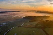 Aerial view of Holkham marshes at dawn, National Nature Reserve, North Norfolk, UK. November, 2020.