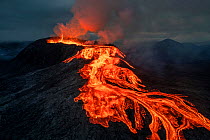 Drone shot of Fagradalsfjall Volcano erupting, with lava flow from crater. Iceland, Europe. June 2021.