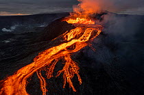 Drone shot of Fagradalsfjall Volcano erupting, with lava flow from crater. Iceland, Europe. June 2021.