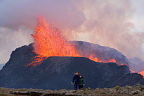Tourists watching eruption of Fagradalsfjall Volcano, Iceland, Europe. May 2021.