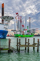 Installation vessel Apollo moored at REBO heavy load terminal, loading two sets of wind turbines for offshore SeaMade wind farm, Ostend port, Belgium. October, 2020.