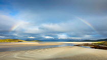 Rainbow over Luskentyre estuary at low tide, Isle of Harris, Outer Hebrides,Scotland, UK. July.