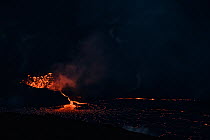 Hot lava spewing from vent within a spatter cone. This feeds a growing lava lake in a pit within the caldera of Halemaumau Crater, Kilauea Volcano, Hawaii Volcanoes National Park, Hawaii Island , Hawa...