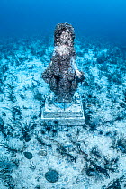 Statue of Virgin Mary placed on seabed at dive site to deter destructive fishing practices by Catholic fishermen, Chocolate Island, Cebu, Philippines, Pacific Ocean. June, 2019.