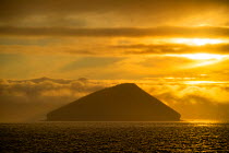 Tuff cone at sunset, Bainbridge Islets, Galapagos, South America. October, 2020.