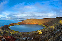 Saline lake in volcanic tuff cone crater, Bainbridge Islets, Galapagos, South America. October, 2020.