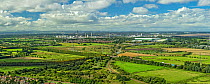 View from Helsby Hill showing the industrial areas of Stanlow and Elton with the main railway line and the M56 motorway in the foreground, Cheshire, UK. September, 2020.