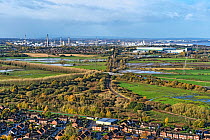 View from Helsby Hill showing the industrial areas of Stanlow and Elton with the main railway line and the M56 motorway in the foreground, Cheshire, UK. September, 2020.