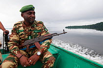 Ecoguard patrolling on the river, Conkouati-Douli National Park, Republic of Congo, Africa.