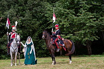 Josephine de Bauharnais standing between two Polish Lancers. First Empire reenactment for the bicentenary anniversary of Napoleon Bonaparte's death, Chateau de Versailles, France.  2021