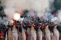 Infantry firing guns. First Empire reenactment for the bicentenary anniversary of Napoleon Bonaparte's death, Chateau de Versailles, France.  2021