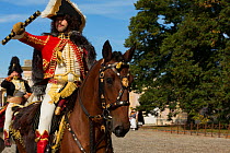 Marechal Murat mounted on Lusitano horse, reviewing troops. First Empire reenactment for the bicentenary anniversary of Napoleon Bonaparte's death, Chateau de Versailles, France.  2021