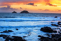 The Brissons, rocky islets off Cape Cornwall, at sunset, Cornwall, Atlantic Ocean, UK. September, 2020.