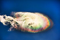 Jet stream winds with rainbow-coloured ice crystals in high cloud, Annapurna Himalayas, Nepal, Asia.