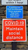 Covid 19 social distancing sign, Ambleside, Lake District National Park, Cumbria, UK. August, 2020.