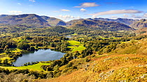 View down to Loughrigg Tarn and the Langdale valley from Loughrigg, Lake District National Park, Cumbria, UK. October, 2020.