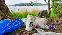 Discarded litter on the shores of Lake Windermere, Ambleside, Lake District National Park, UK. May, 2020.
