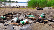 Discarded litter left by visitors, Ambleside, Lake District National Park, Cumbria, UK. June.