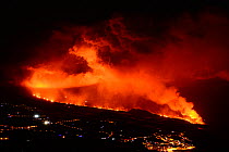 Lava flow and ash from erupting volcano passing close by the village of Los Llanos de Aridane, Volcano Cumbre en Vieja, La Palma, Canary Islands. November, 2021.