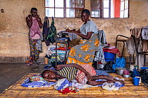 Joana Angelina (14) so ill from tuberculosis that she could not stand, lying in temporarily converted school, after Cyclone Idai. Outskirts of Gorongosa National Park, Mozambique. March 2019.