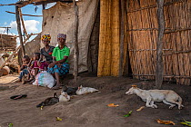 Rosa Domingo with her food kit and Isabel Ofece Alfandega (39) in their compound, with their children Gerardo (9) and Izakel (6), after Cyclone Idai. Outskirts of Gorongosa National Park, Mozambique....