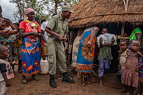 Park ranger overseeing emergency food distribution after Cyclone Idai. Outskirts of Gorongosa National Park, Mozambique. March 2019.