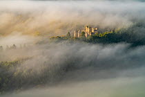 Aerial view of Lennox Castle engulfed in fog during a morning inversion, Lennoxtown, East Dunbartonshire, Scotland. October, 2020.