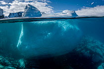 Split level view of an iceberg, Kinnes Cove, Joinville Island, Antarctica Peninsula, Southern Ocean.