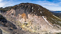 Aerial panorama of sulphur and steam vents at Mount Iozan within the Kussharo caldera. Lake Kussharo is visible in far right background. Hokkaido, Japan. March.