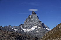 Lenticular cloud over the summit of the Matterhorn, Zermatt, The Alps, Switzerland. October, 2019.