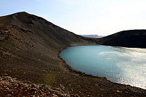 Lake in volcanic cone in region of Landmannalaugar mountains, Iceland. July.