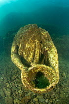 Ancient Roman statue of Ulysses with cup of wine, located in submerged Nymphaeum of Emperor Claudius. Marine Protected Area of Baia, Naples, Italy. Tyrrhenian sea.