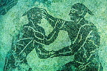 Ancient Roman black and white mosaic floor depicting  two male athletes wrestling. Marine Protected Area of Baia, Naples, Italy. Tyrrhenian sea.