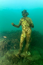Ancient Roman statue of the god of intoxication and happiness Dionysus,  located in submerged Nymphaeum of Emperor Claudius. Marine Protected Area of Baia, Naples, Italy. Tyrrhenian sea.