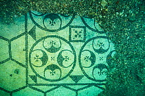 Ancient Roman tessellatum mosaic in black and white decorated with pattern of hexagons, perfectly preserved, in Villa a Protiro. Marine Protected Area of Baia, Naples, Italy. Tyrrhenian sea.
