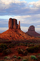 View of the iconic sandstone buttes named The 'Mittens', at sunset, Monument Valley, Navajo Tribal Park. Arizona, USA.
