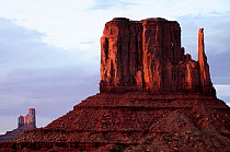 View of the iconic sandstone butte named The 'Mittens', at sunset, Monument Valley, Navajo Tribal Park. Arizona, USA.