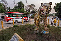 A huge Bengal tiger  statue welcomes tourists and locals in downtown Bardia,near  Bardia National Park, Terai, Nepal.