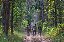 Soldiers from the Nepalese Army patrolling Bardia National Park on foot, Bardia National Park, Terai, Nepal.