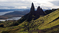 Tourists hiking with The Old Man of Storr in the background, Trotternish peninsular, Isle of skye, Scotland, UK.