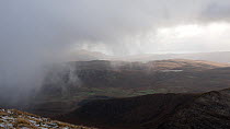 Snow showers and clouds rolling in over Strath Aird, Beinn Dearg Bheag, Isle of skye, Scotland, UK.