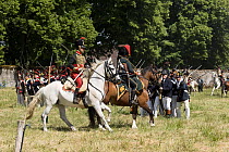 Cavalry attacking square formation formed by infantry, during First Empire  military reenactment. Montigny, Normandy, France. 2022.